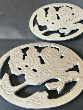 VTG silver-plated metal trivet w/ ornate grape/leaf design, India, 8.5x7